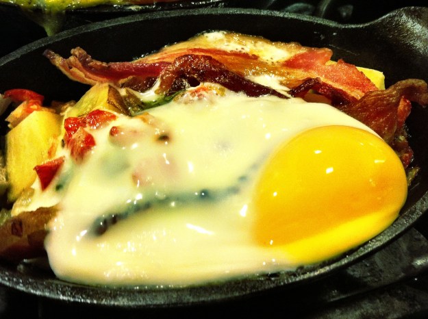 Baked bacon, egg, cheese, pico and potatoes.  