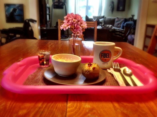 Idaho Sunrise (egg cooked in baked potato), strawberries and Greek yogurt, hot tea and meds.