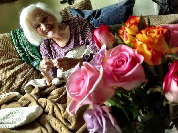 Grandma enjoys her flowers.
