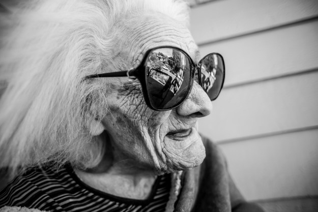 Grandma likes to watch the world go by on the porch.